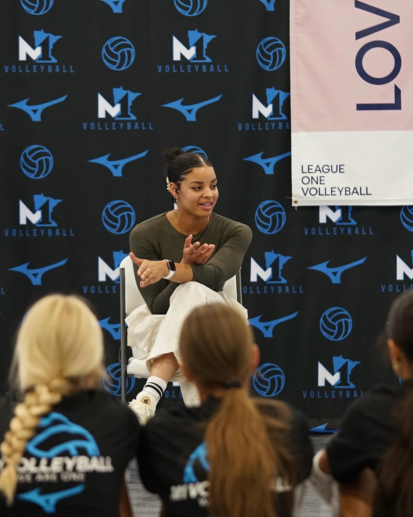 Alexis Hart speaking with young volleyball athletes